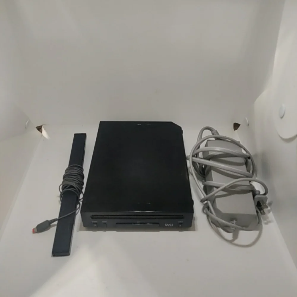 Nintendo Wii Black Console with AV cord, plug and bar used.. Tested the Nintendo